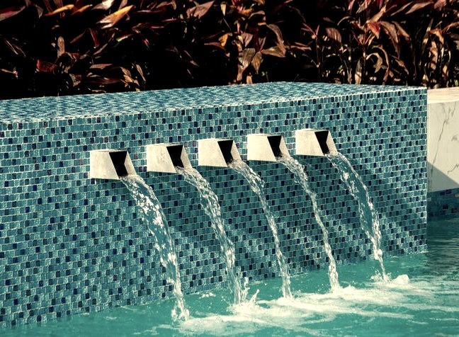 Large contemporary pool fountain design featuring a custom-shaped pool fountain
