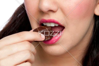Cropped Woman Eating Chocolate